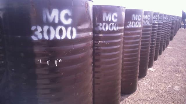 Bitumen barrels labeled MC 3000