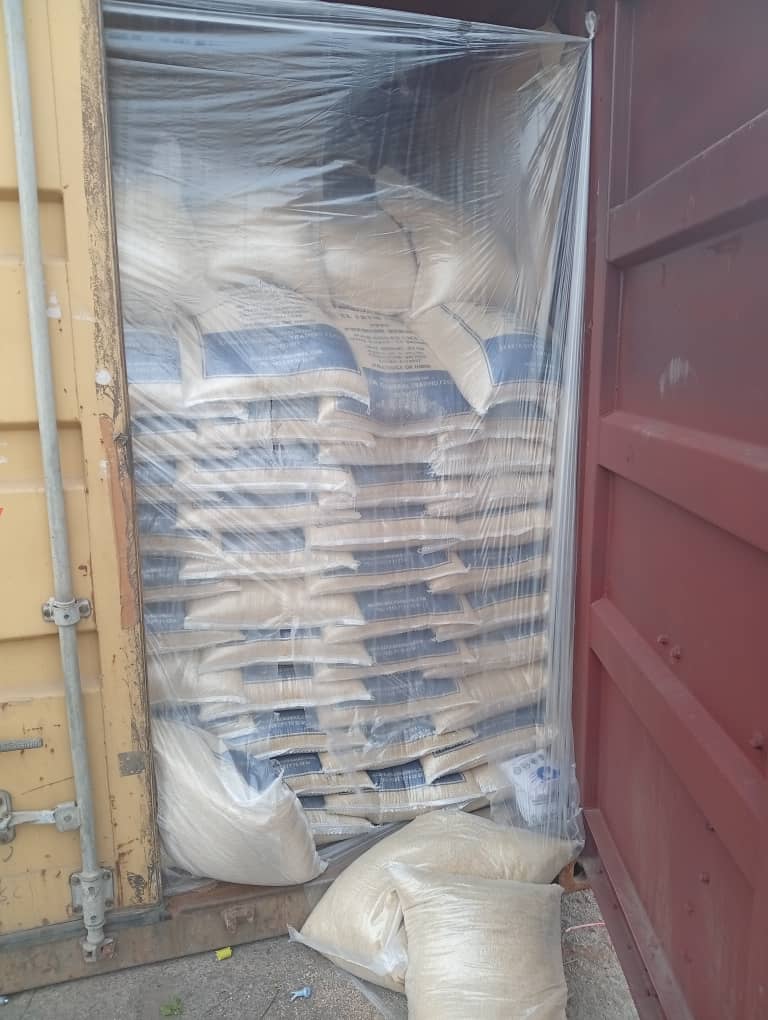 Stacked rice bags in container
