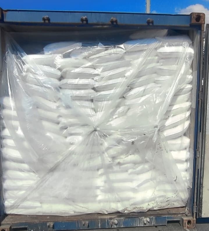 Shipping container loaded with wheat flour bags